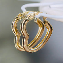 Load image into Gallery viewer, Heart shaped hoops in 14k yellow gold