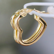 Load image into Gallery viewer, Heart shaped hoops in 14k yellow gold