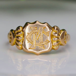 Antique shield shaped MC/CM signet ring in yellow gold