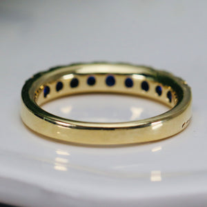 High quality sapphire band in 14k yellow gold