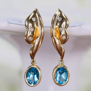 Estate Blue topaz and diamond earrings in 14k yellow gold