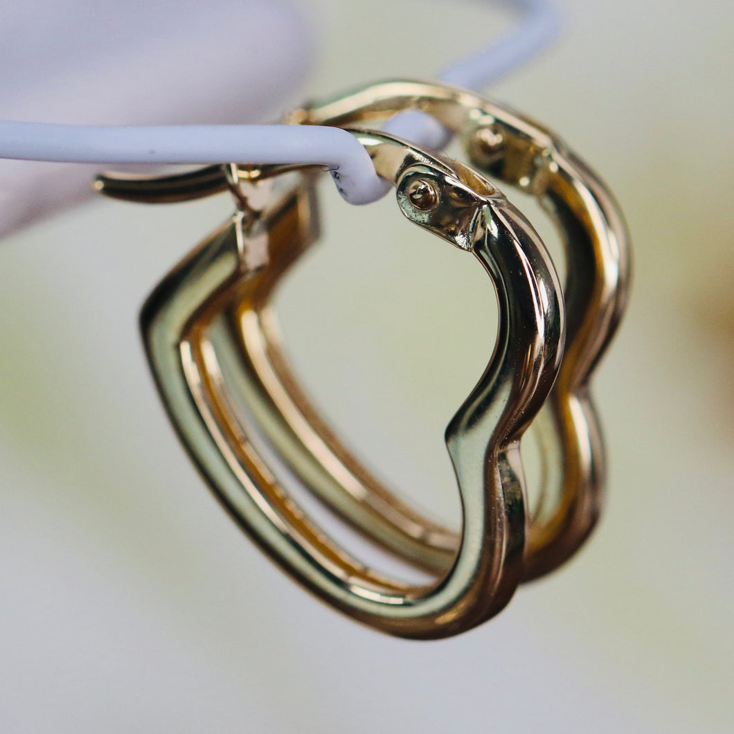 Heart shaped hoops in 14k yellow gold