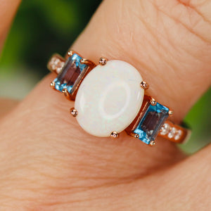 Opal and blue topaz ring in rose gold