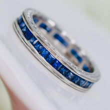 Load image into Gallery viewer, Engraved sapphire eternity band in engraved platinum