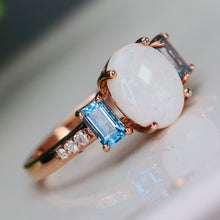 Load image into Gallery viewer, Opal and blue topaz ring in rose gold