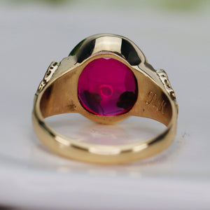 Smooth top oval synthetic ruby ring in yellow gold