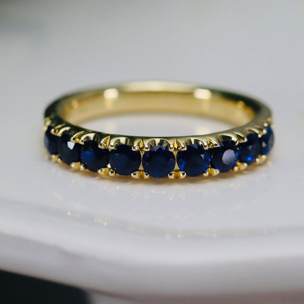 High quality sapphire band in 14k yellow gold