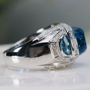 Blue topaz ring with floating diamonds in 14k white gold