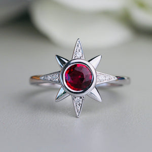 Ruby and diamond compass star ring in 14k white gold