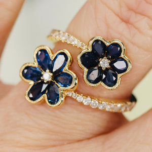 Sapphire and diamond flower style bypass ring in 14k white gold