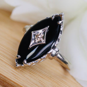 Vintage onyx and diamond navette ring in white gold