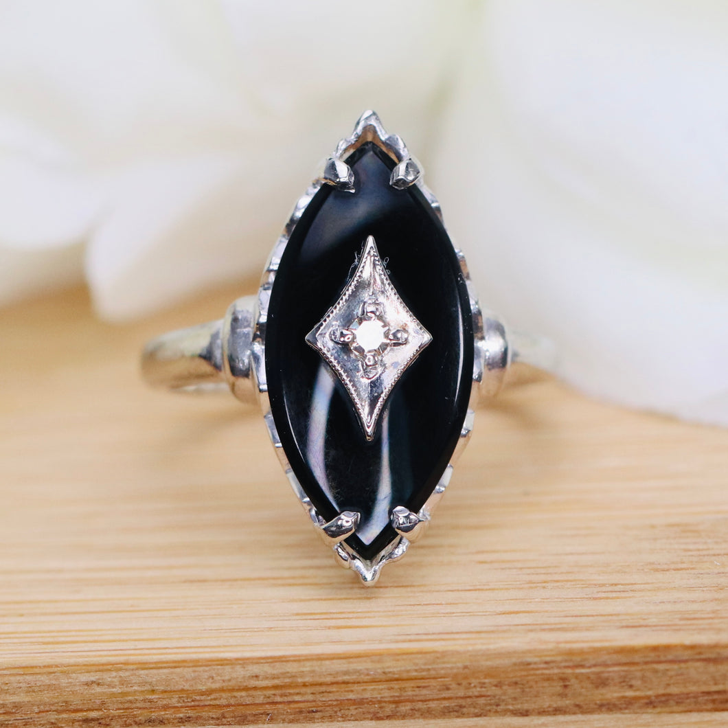 Vintage onyx and diamond navette ring in white gold