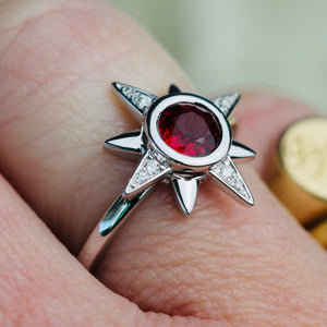 Ruby and diamond compass star ring in 14k white gold