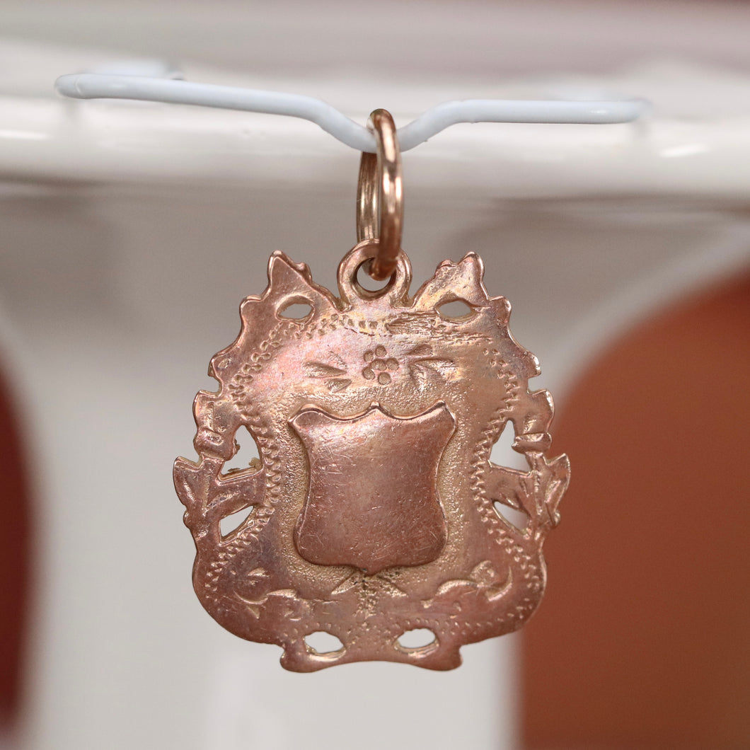 Antique rose gold shield medal