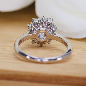 Vintage Emerald cut diamond cluster ring in platinum
