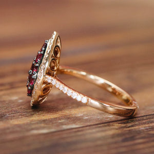 Rhodolite and diamond pear shape cluster ring in 14k rose gold