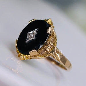 Classic vintage onyx and diamond ring in yellow gold