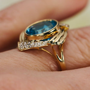 Swiss blue topaz and diamond ring in 14k yellow gold