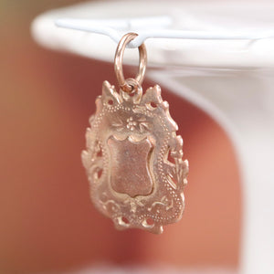 Antique rose gold shield medal