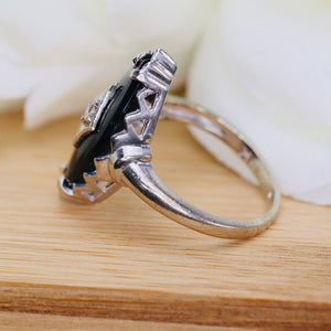 Vintage onyx and diamond navette ring in white gold