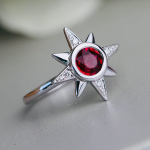 Ruby and diamond compass star ring in 14k white gold