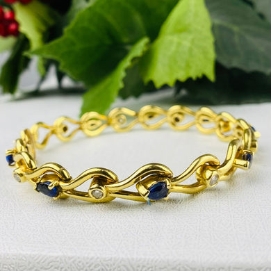 Sapphire and diamond bracelet in 18k yellow gold