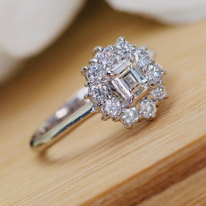 Vintage Emerald cut diamond cluster ring in platinum