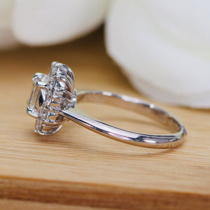 Vintage Emerald cut diamond cluster ring in platinum