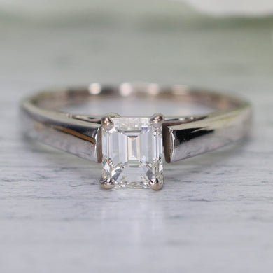 Estate emerald cut diamond solitaire ring in 18k white gold