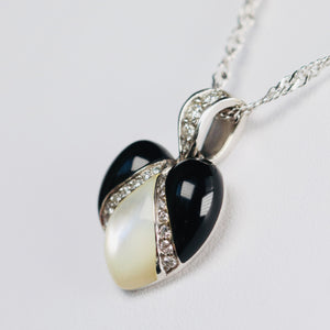 Onyx, mother of pearl and diamond pendant from Kabana