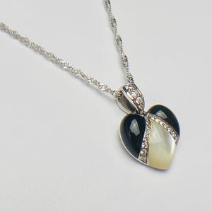 Onyx, mother of pearl and diamond pendant from Kabana