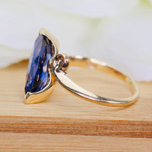 Load image into Gallery viewer, Marquise cut synthetic blue sapphire ring in yellow gold