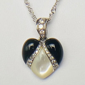 Onyx, mother of pearl and diamond pendant from Kabana