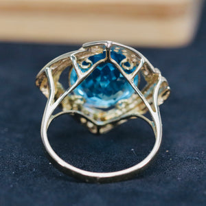 Swiss blue topaz and diamond ring in 14k yellow gold