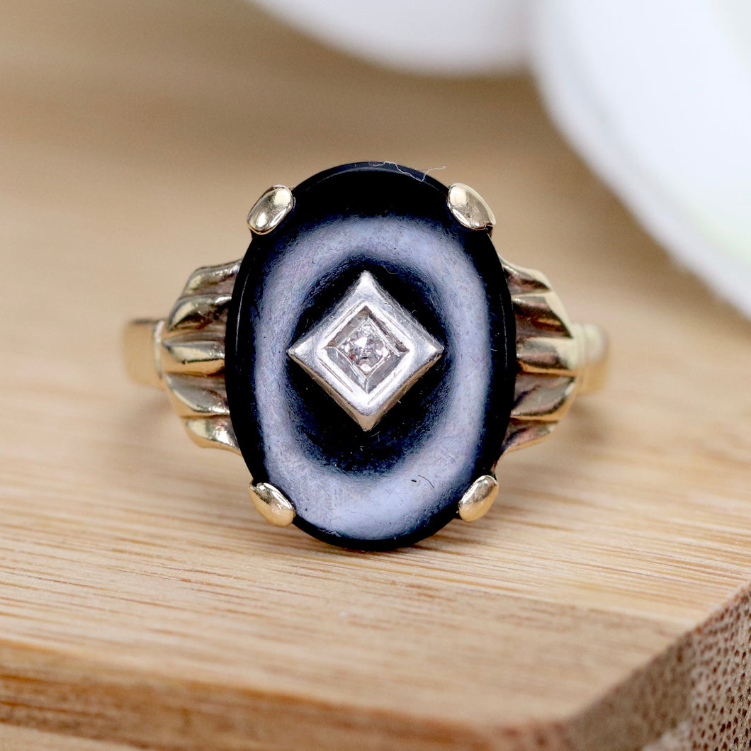 Vintage Onyx and diamond oval ring in yellow gold