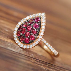Rhodolite and diamond pear shape cluster ring in 14k rose gold
