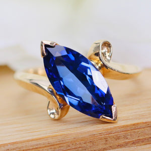 Marquise cut synthetic blue sapphire ring in yellow gold