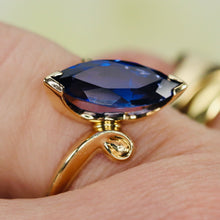 Load image into Gallery viewer, Marquise cut synthetic blue sapphire ring in yellow gold