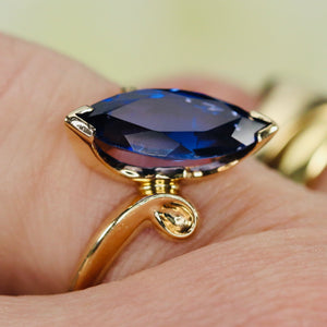 Marquise cut synthetic blue sapphire ring in yellow gold
