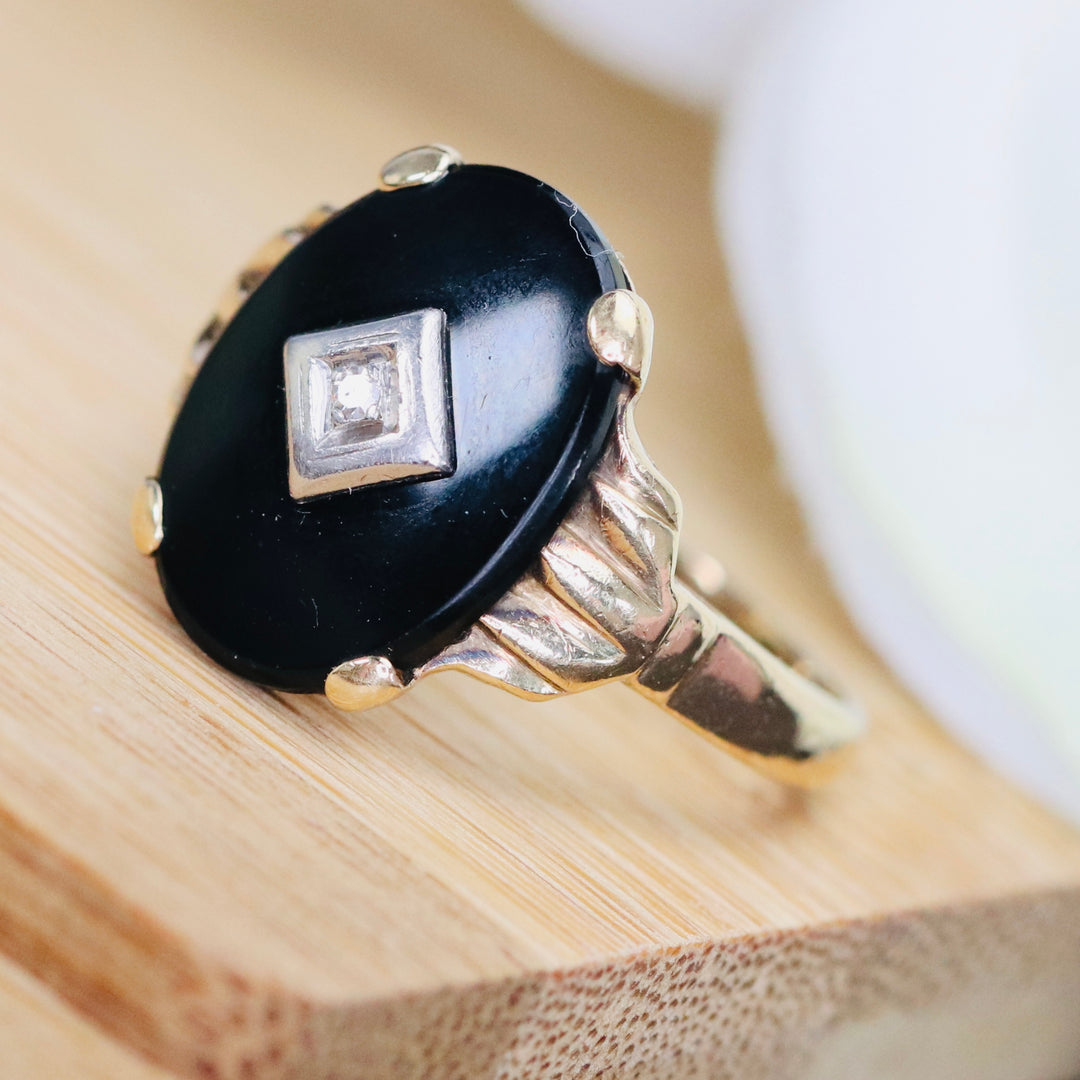 Vintage onyx and diamond ring in yellow gold