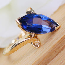 Load image into Gallery viewer, Marquise cut synthetic blue sapphire ring in yellow gold