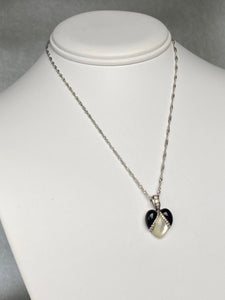 Onyx, mother of pearl and diamond pendant from Kabana