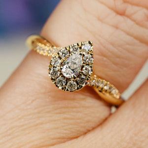 Pear shape diamond cluster ring in 14k yellow gold