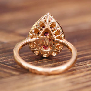 Rhodolite and diamond pear shape cluster ring in 14k rose gold