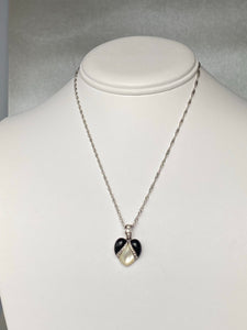 Onyx, mother of pearl and diamond pendant from Kabana