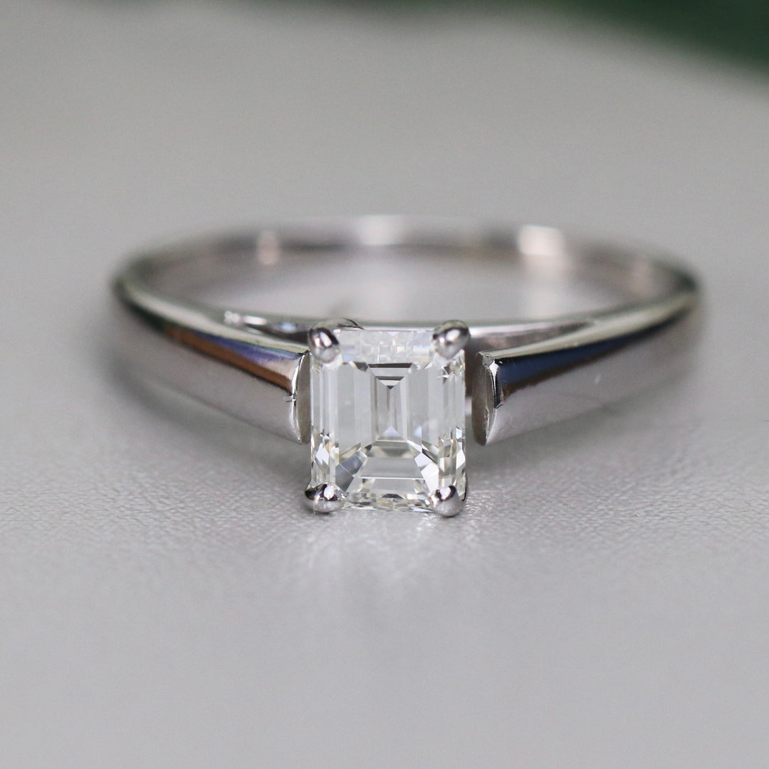 Estate emerald cut diamond solitaire ring in 18k white gold