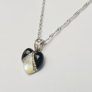 Onyx, mother of pearl and diamond pendant from Kabana