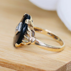 Vintage Onyx and diamond oval ring in yellow gold