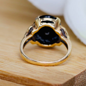 Vintage Onyx and diamond oval ring in yellow gold