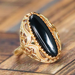 Pierced design vintage onyx ring in yellow gold